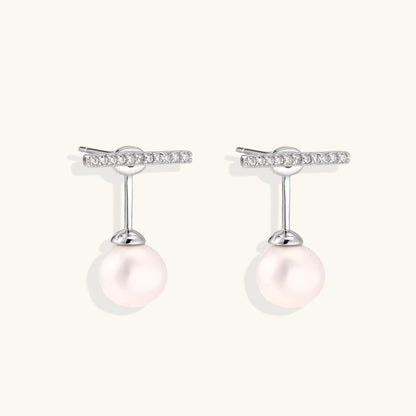 Rhodium-plated sterling silver ear jacket earrings with diamond-set horizontal bar and freshwater pearl drop